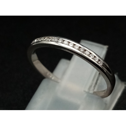 597 - 18k white gold channel set diamond half eternity ring 1.8g Size M (dia:0.15ct)