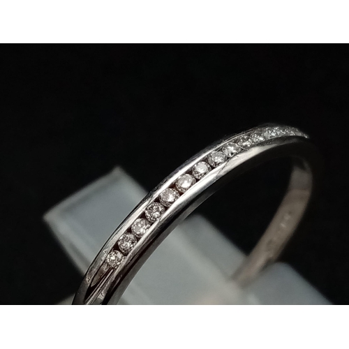 597 - 18k white gold channel set diamond half eternity ring 1.8g Size M (dia:0.15ct)