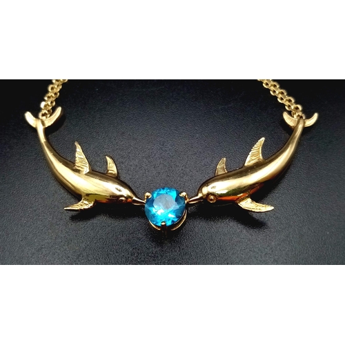 208 - 14k yellow gold dolphin necklace set with blue topaz (topaz:1.55ct)