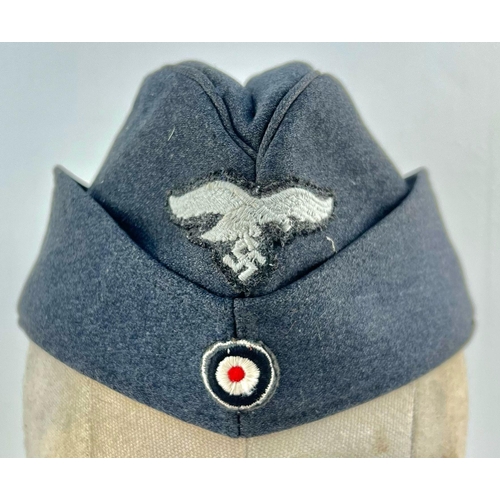 194 - WW2 German Luftwaffe Enlisted Mans/NCO’s Side Cap. The cap with embroidered roundel and Luftwaffe Ea... 