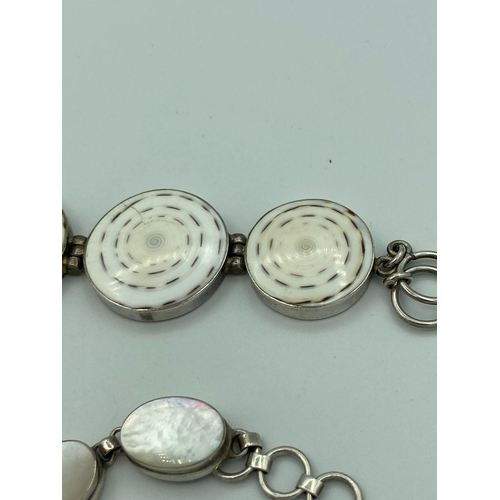 266 - 2 x VINTAGE SILVER BRACELETS set with agate and mother of pearl. T-bar fastening. No silver markings... 