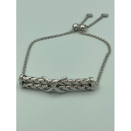 511 - SILVER ‘Together Forever’ BRACELET having two SILVER ROPE BARS  held together with a  SILVER KISS. S... 