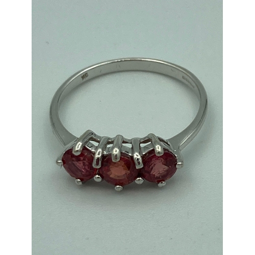 55 - 9 ct WHITE GOLD and RUBY RING having a three stone RUBY  trilogy mounted to top. Full UK Hallmark. 1... 