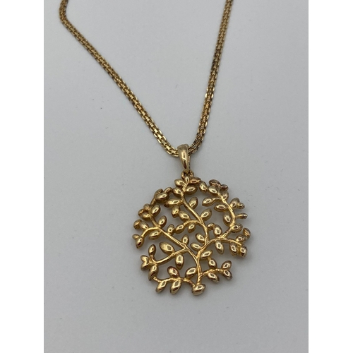 714 - Beautiful SILVER openwork LEAF PENDANT mounted on a fancy silver chain. Both pieces gilded to appear... 