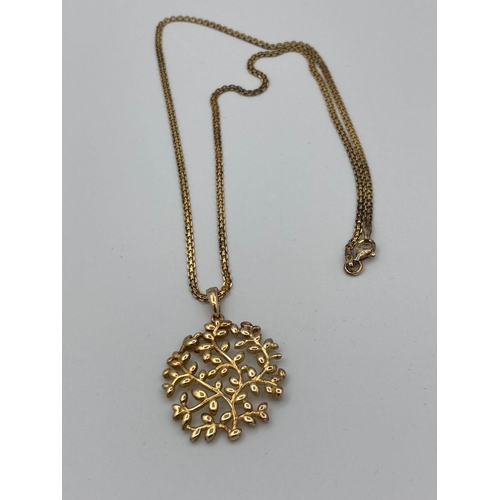 714 - Beautiful SILVER openwork LEAF PENDANT mounted on a fancy silver chain. Both pieces gilded to appear... 