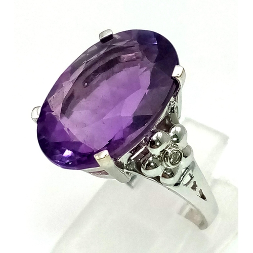 256 - 18K White Gold DIAMOND & AMETHYST COCKTAIL RING. Total Weight 6.4G. 10CT OVAL AMETHYST.  SIZE M 1/2