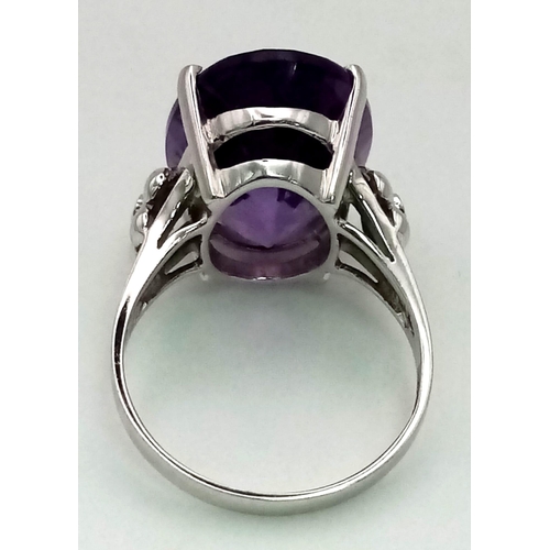 256 - 18K White Gold DIAMOND & AMETHYST COCKTAIL RING. Total Weight 6.4G. 10CT OVAL AMETHYST.  SIZE M 1/2