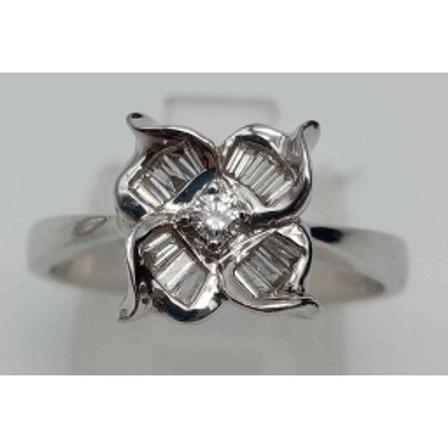 313 - 18K White Gold DIAMOND SET FLOWER RING 0.22CT 4.1G SIZE O