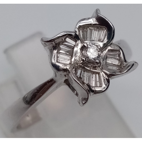 313 - 18K White Gold DIAMOND SET FLOWER RING 0.22CT 4.1G SIZE O