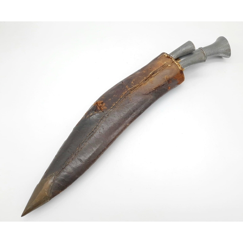 429 - Vintage Nepalese/Gurkha Style Kukri Knife in Sheath. Complete with the two traditional smaller
blade... 