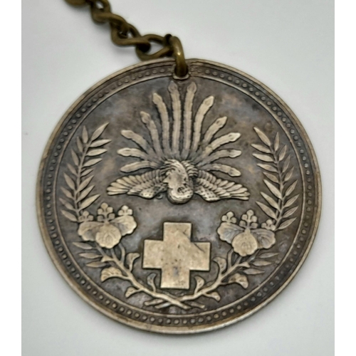 638 - A RARE 1889 JAPANESE RED CROSS MEDAL ON FOB CHAIN.