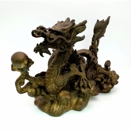 9 - A Chinese Qing Dynasty Dragon with Pearl Ball Bronze. Inspired by the legend of the dragon and the p... 