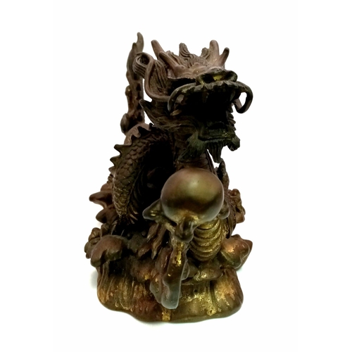 9 - A Chinese Qing Dynasty Dragon with Pearl Ball Bronze. Inspired by the legend of the dragon and the p... 