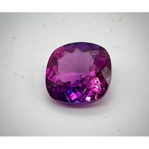 673 - A 24ct Purple/Pink Tanzanite. Cushion cut with 17 x 17 x 8mm dimensions. No visible inclusions. Heat... 