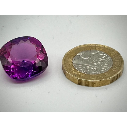 673 - A 24ct Purple/Pink Tanzanite. Cushion cut with 17 x 17 x 8mm dimensions. No visible inclusions. Heat... 