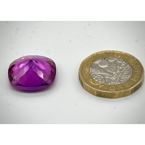 673 - A 24ct Purple/Pink Tanzanite. Cushion cut with 17 x 17 x 8mm dimensions. No visible inclusions. Heat... 