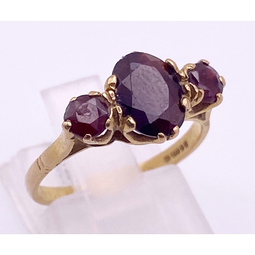 704 - 9K Yellow Gold GARNET 3 STONE RING 2.1G SIZE L 1/2