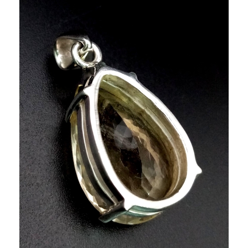 979 - 925 Silver Citrine pendant with Matching Ring. Total Weight 21.84g. Ring Size 0.