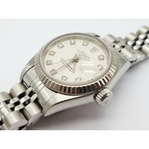 646 - LADIES ROLEX OYSTER PERPETUAL DATEJUST STAINLESS STEEL WATCH WITH MAGNOLIA FACE AND DIAMOND NUMERALS... 