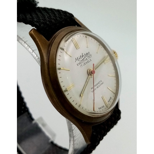 214 - A Vintage Mithras 17Jewel Executive 707 Gents watch. Cloth strap. Two tone case - 34mm. Mechanical m... 