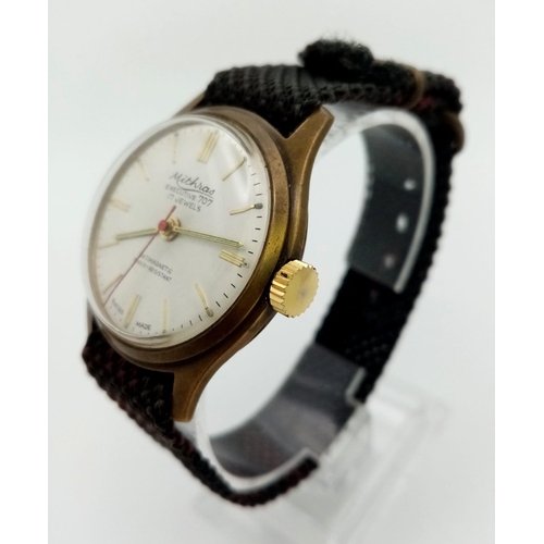 214 - A Vintage Mithras 17Jewel Executive 707 Gents watch. Cloth strap. Two tone case - 34mm. Mechanical m... 