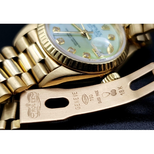 254 - 18K YELLOW GOLD LADIES ROLEX OYSTER PERPETUAL DATE JUST WATCH WITH MOTHER OF PEARL FACE AND DIAMOND ... 