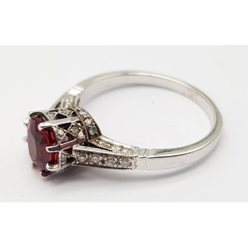 261 - 18K WHITE GOLD RING SET WITH CENTRAL ROUND CUT NATURAL RUBIES AND 44 ROUND BRILLIANT CUT RUBIES ON T... 