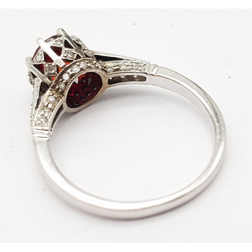 261 - 18K WHITE GOLD RING SET WITH CENTRAL ROUND CUT NATURAL RUBIES AND 44 ROUND BRILLIANT CUT RUBIES ON T... 