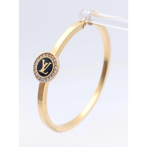 417 - A Large 14K Yellow Gold LV Hoop Earring - 5.52g and a 14K Gold bracelet - 18cm - 4.54g total weight.... 