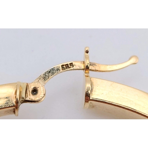 417 - A Large 14K Yellow Gold LV Hoop Earring - 5.52g and a 14K Gold bracelet - 18cm - 4.54g total weight.... 