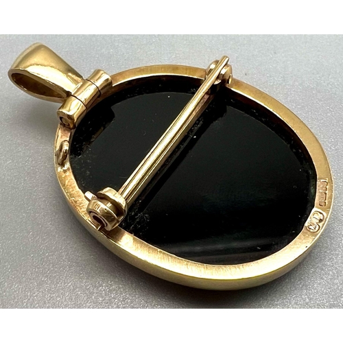 192 - An Antique Carved Opal Cameo Pendant set in Black Onyx - cased in 9k yellow gold. 4.5cm. 10.25g tota... 