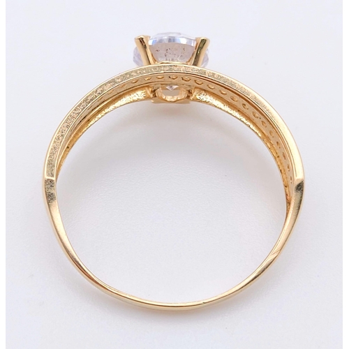 727 - A Pair of 14K Yellow Gold Hoop earrings and a 14K Yellow Hold Ring with White Stones. 5.1g total wei... 