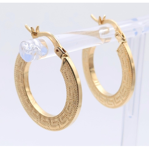 727 - A Pair of 14K Yellow Gold Hoop earrings and a 14K Yellow Hold Ring with White Stones. 5.1g total wei... 