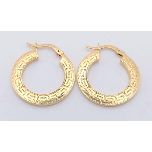 727 - A Pair of 14K Yellow Gold Hoop earrings and a 14K Yellow Hold Ring with White Stones. 5.1g total wei... 