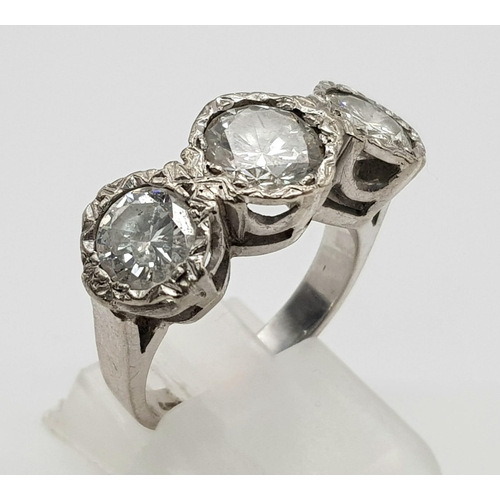 85 - An 18K White Gold Diamond Trilogy Ring. 1.3ct. Size N. 8.16g total weight.