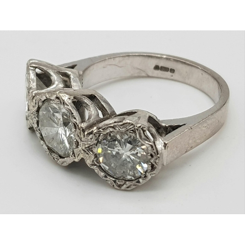 85 - An 18K White Gold Diamond Trilogy Ring. 1.3ct. Size N. 8.16g total weight.