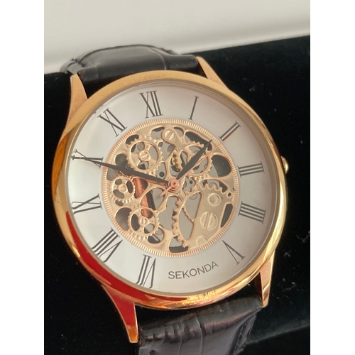 772 - Gentlemans Quartz SEKONDA SKELETON wristwatch. Having white face with black Roman numerals .Finished... 