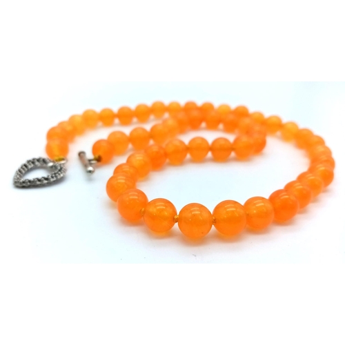 758 - An Orange Topaz Small Bead Necklace. Heart clasp. 8mm beads. 42cm