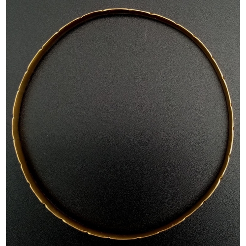 1064 - A 22K GOLD BANGLE. 8.3gms  3-12979