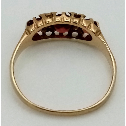 184 - An Antique 9K Yellow Gold Garnet and Diamond Ring. Three rich garnets and four small diamonds. Size ... 