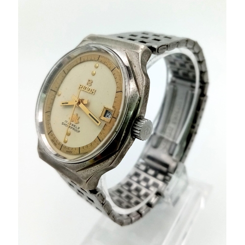 470 - A Vintage Ricoh 17 Jewel Shockproof Gents watch. Stainless steel strap and case - 36mm. Two tone dia... 