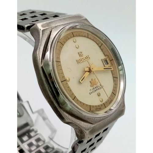 470 - A Vintage Ricoh 17 Jewel Shockproof Gents watch. Stainless steel strap and case - 36mm. Two tone dia... 