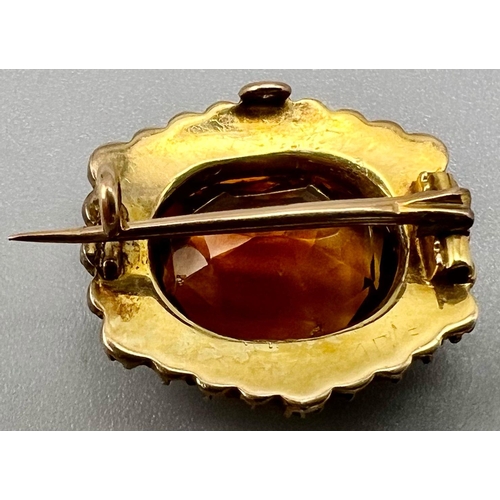 510 - A Victorian Madeira Topaz and Seed Pearl Brooch. Set in High-Karat gold. 22mm. 4.61g total weight.