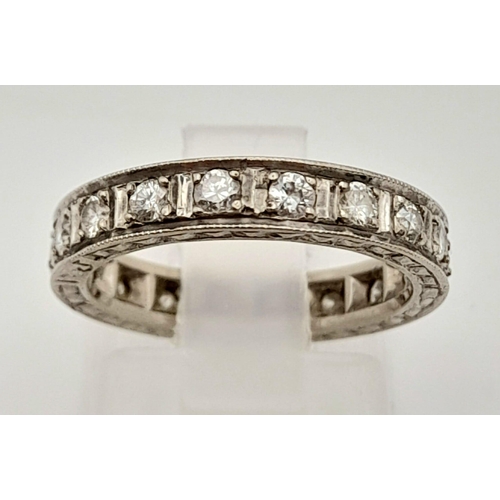 92 - A Platinum Diamond Eternity Ring. 20 round cut diamonds.
Size J. 3.74g total weight.