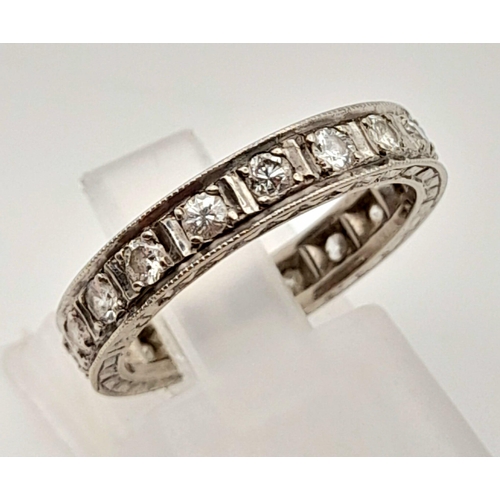 92 - A Platinum Diamond Eternity Ring. 20 round cut diamonds.
Size J. 3.74g total weight.