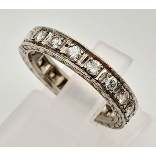 92 - A Platinum Diamond Eternity Ring. 20 round cut diamonds.
Size J. 3.74g total weight.