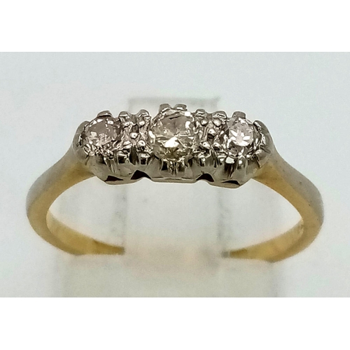 154 - A Vintage 18K Gold and Platinum Diamond Trilogy Ring. Size L/M. 2.27g total weight.