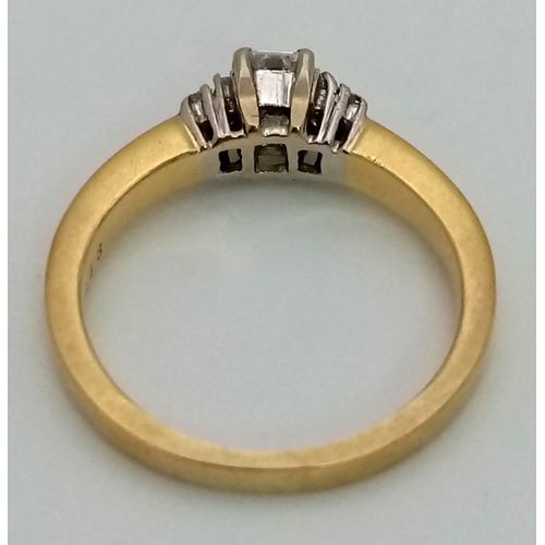 170 - An 18K Yellow Gold Graduating Emerald-Cut Diamond Ring. 
Size K/L. 4.07g total weight. 0.48ct.