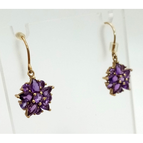 608 - 9K YELLOW GOLD AMETHYST SET FLOWER DROP EARRINGS 2.45G