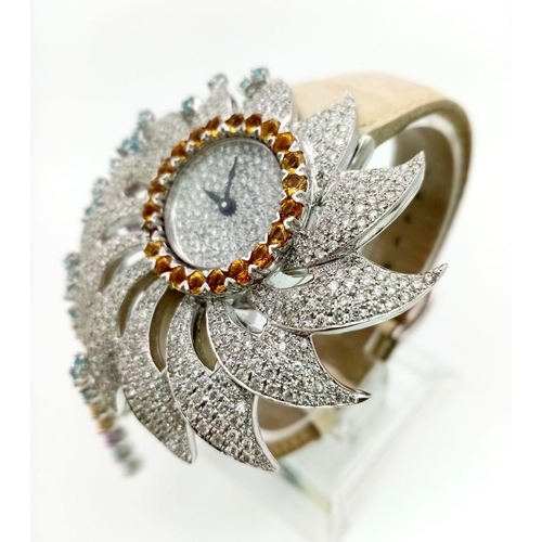 148 - AN 18K WHITE GOLD AND DIAMOND DRESS WATCH BY COBRA , DIAMOND RAYS AND BEZEL. ONE SMALL CITRINE MISSI... 